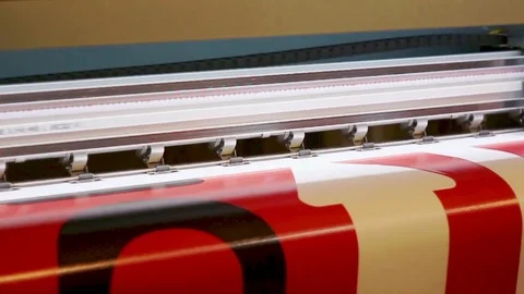 Wide format digital printing. Self adhesive film. Red color. Video stock 80436548