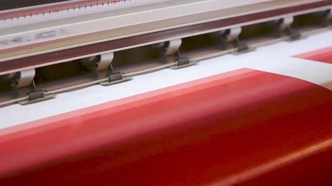 Wide format digital printing. Self adhesive film. Red color. Video stock 80436551