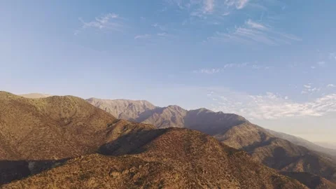 Wide forward tracking aerial shot of the vast Andes mountain range extending Stock Footage 333285420