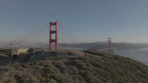 Wide forward tracking revealing SF bridge from behind hill Stock Footage 336792016