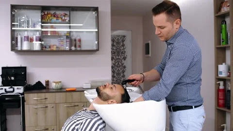 Wide frame with a milling machine that washes the client's hair or after the Stock Footage 144289604