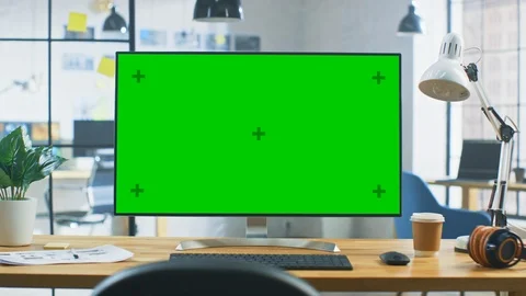 Wide Green Mock-up Screen Desktop Computer Standing on the Desk in Modern Office Video stock 110724473
