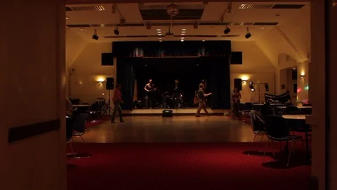 Wide hand held shot of first guests arriving at event function room Stock-Footage 107628639