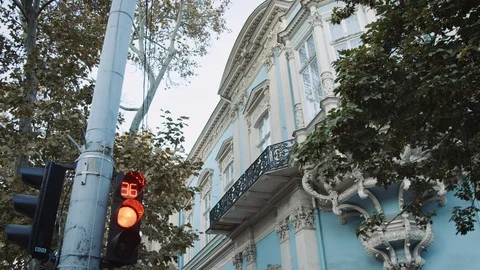 Wide handheld view of traffic light on street corner Odessa Ukraine RED Camera 스톡 동영상 122534233