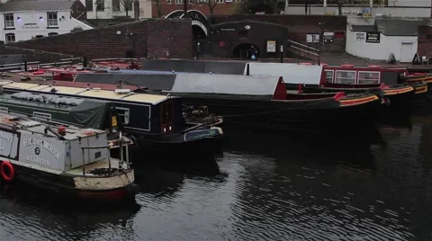 Wide High Angle Pan of Narrow Boats Docked in Canal Harbour 動画素材 44524850