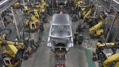 Wide high-angle perspective of an expansive automotive production line Stock Footage 332976681