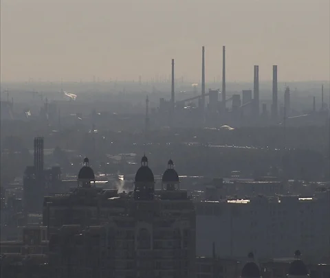 Wide high angle view of coal burning power plant through thick smog and haze Stock Footage 86745045