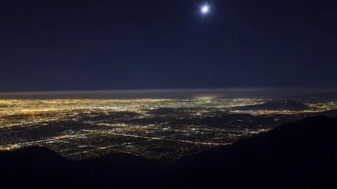 Wide High Angle View of the Moon Setting Over Los Angeles at Night Video stock 76632778