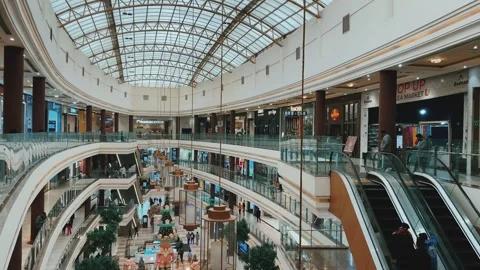 Wide Interior View of Modern Shopping Mall with Multiple Floors and Escalators Stock Footage 338220803