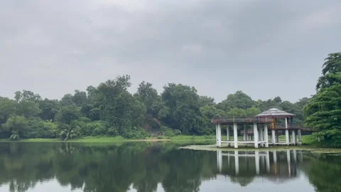 Wide Landscape View of a Hidden Park Pavilion and Moody Monsoon Sky. Stock Footage 344777321