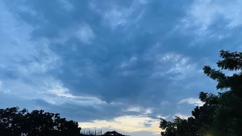 Wide Landscape View of Storm Clouds and Suburban Horizon at Dusk. Stock Photos