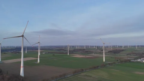 Wide lateral pass over extensive wind farm landscape Stock Footage 331213347