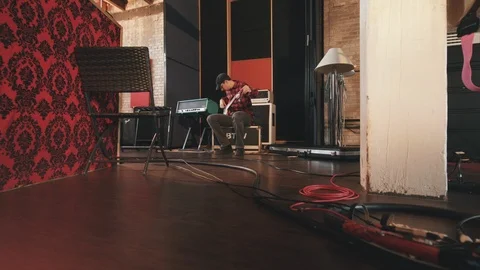 Wide Left Move Low Angle Bass Player Tuning Guitar Stock Footage 89511529