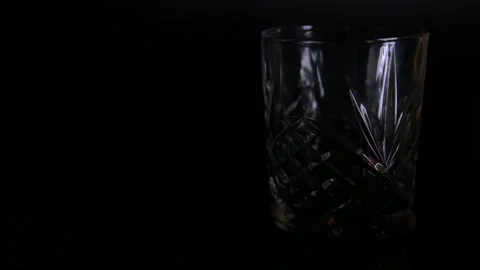 Wide Light On Empty Traditional Whiskey Glass Stock Footage 140807585