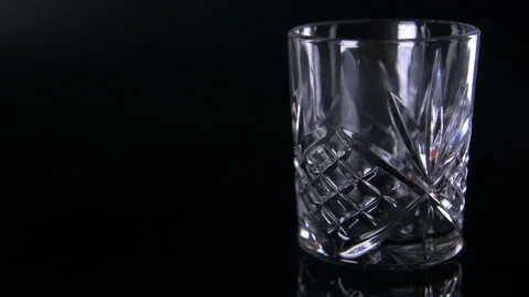 Wide Light Swirl Empty Traditional Whiskey Glass Stock Footage 140808593