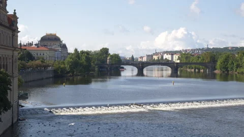 Wide looking at bridge over Vltava River in Prague, Czech Republic on sunny day Vídeos de archivo 284792194