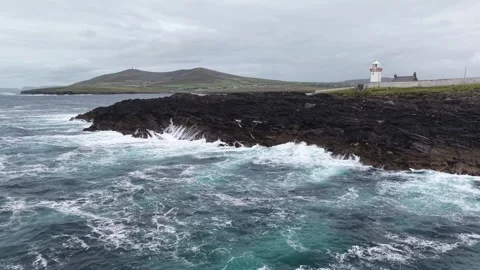 Wide low-altitude drone shot of foaming ocean near Ballyglass, Ireland. Stock Footage 342730338