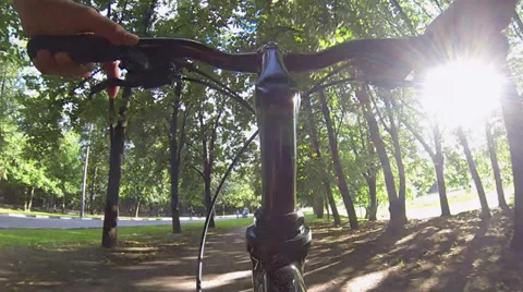 Wide Low Angle Pov Of Cyclist Bike While Riding Bicycle On A Park Road HD Video stock 39934646
