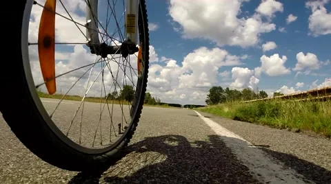 Wide Low Angle Pov Of Cyclist Bike While Riding Bicycle On Country Road Video stock 40617588