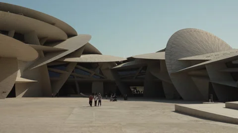 Wide Low Angle Shot of Tourists Walking in the National Museum of Qatar. Stock Footage 338117704