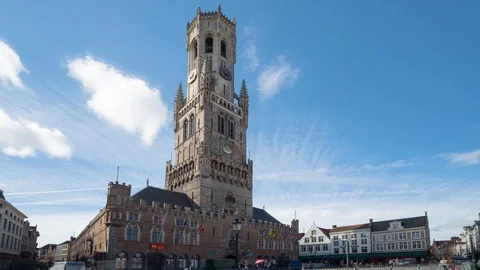 Wide (low angle) timelapse video of Bruges cityscape with the Belfry Tower Stock Footage 103444474