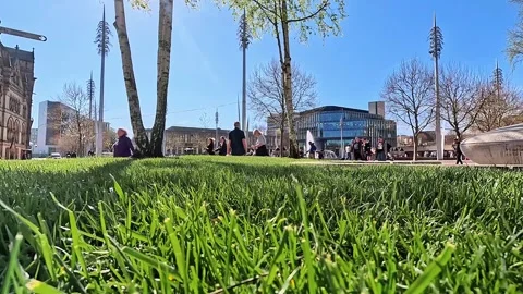 Wide low-angle view of green grass and modern architecture in Bradford Stock Footage 334995687