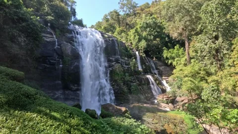 Wide low-angle view of large waterfall with mini falls in northern Thailand Video stock 339981945