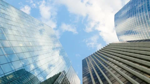 Wide low-angle view looking straight up at corporate skyscrapers with sleek glas Stock Footage 338027551