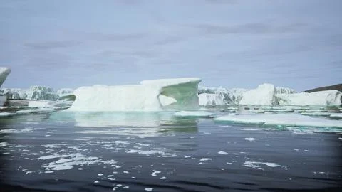 A wide low angle view of melting sea ice floes in still waters of Arctic Stock Illustration