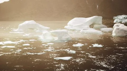 A wide low angle view of melting sea ice floes in still waters of Arctic Illustrazione stock
