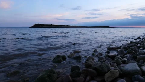 Wide Low Shot Of Sunset Over Tidal Island 4K Slow Motion 스톡 동영상 212077222