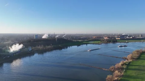 Wide meadow pass with cargo ship on the Rhine Stock-Footage 331204503