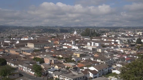 Wide to a medium shot of downtown Popayan, Colombia on a sunny day 스톡 동영상 109078424