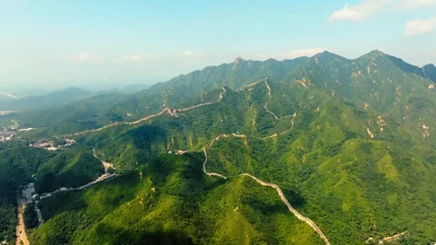 Wide mountain panorama with Great Wall lines and drifting cloud shadows Stock Footage 346576528