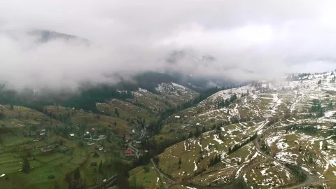 Wide mountain valley and cloudscape above, view from drone Stock Footage 281341823