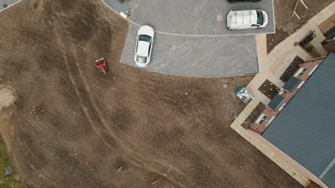 A wide move from the ground directly up over a local village Stock Footage 296802921