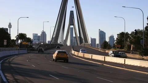 Wide multi-lane highway through Anzac bridge to Sydney city CBD in 4k. Stock Footage 160736858