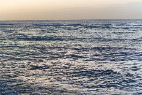 Wide Ocean View Under Clear Bright Blue Sky Stock Photos