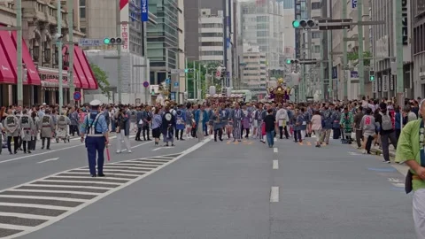 Wide Open Avenue Frames Distant Shrine and Gathering Crowd Stock Footage 341570328