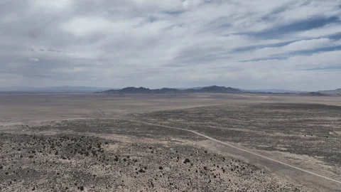 Wide Open Desert and Dramatic Skies over Rocky Mountains in Utah Stock Footage 313750499