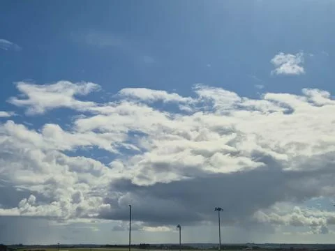 Wide open sky with dramatic clouds over horizon Stock Photos