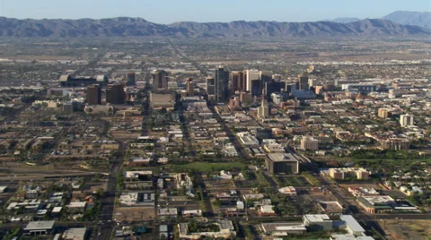 Wide orbit of Phoenix with downtown in mid-frame, mountains in background. Shot Stock Footage 59523451