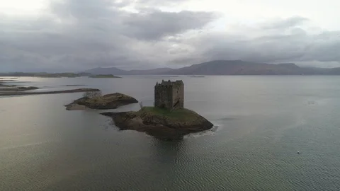 Wide orbiting movement around Castle Stalker, Scotland Stock Footage 102404668