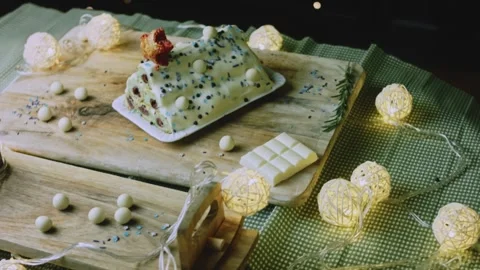 Wide overhead serving scene with cake and string lights Stock Footage 342129833