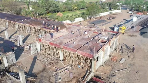 Wide overhead tracking drone shot mapping out a sprawling multi wing commercial Stock Footage 337790066