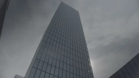 Wide Pan Around Messe Basel Congress Center Tower with Sun and Blue Sky (LOG) Stock Footage 158888959