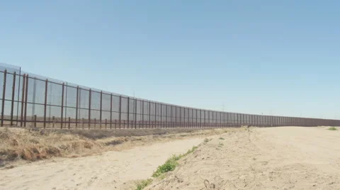 Wide Pan of Border Fence Stock Footage 60387414