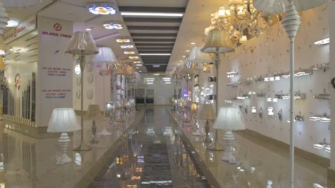 Wide pan display of different kinds of lightings in a store Stock Footage 97573381