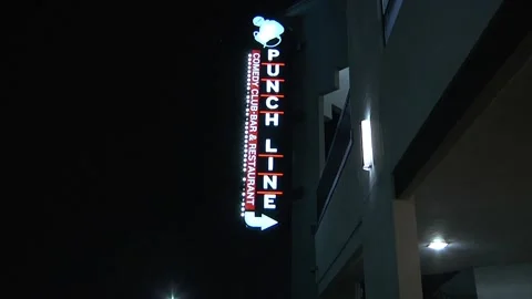 Wide Pan Down of Punchline Comedy Club Sign Night Stock Footage 170469876