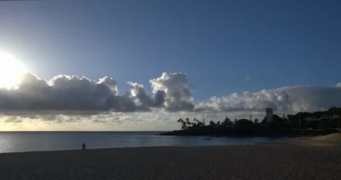 Wide Pan Left Waimea Bay with Sun Behind Clouds, 4K60p Stock Footage 101096061